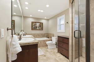 Bathroom featuring double vanity, a shower stall, a bath, recessed lighting, and light tile patterned floors
