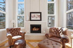 Living area with a brick fireplace