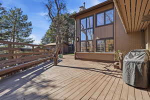 Wooden deck featuring grilling area