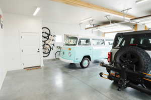 Garage with baseboards and a garage door opener