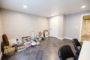 Office space with recessed lighting and dark wood-type flooring
