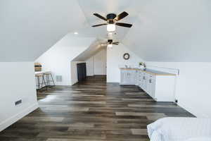Bonus room with dark wood-style floors, vaulted ceiling, a ceiling fan, and recessed lighting