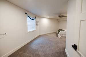 Unfurnished bedroom with carpet, a ceiling fan, and recessed lighting