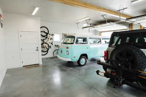 Garage with baseboards and a garage door opener