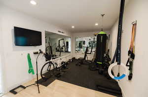 Workout area featuring recessed lighting