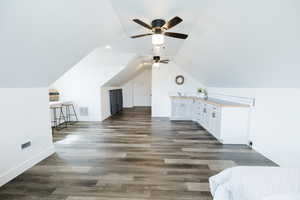 Bonus room featuring dark wood-style flooring, lofted ceiling, a ceiling fan, and recessed lighting