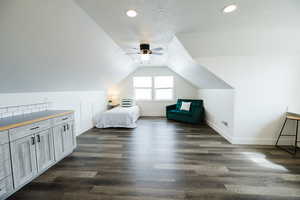 Bedroom with dark wood finished floors, a ceiling fan, and recessed lighting