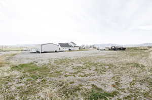 View of yard with a mountain view and a rural view