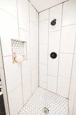 Full bath with a tile shower