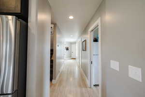 Hallway featuring recessed lighting and light wood-type flooring