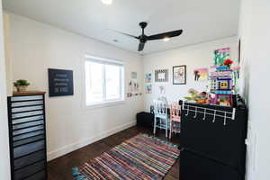 Office space featuring dark wood-type flooring, a ceiling fan, and recessed lighting