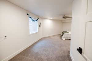 Unfurnished bedroom with carpet flooring, ceiling fan, and recessed lighting