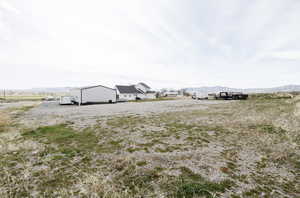 View of yard featuring a mountain view and a view of countryside