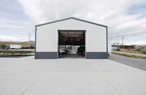 View of outbuilding with driveway