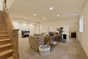 Living room featuring light colored carpet and recessed lighting