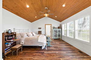 Bedroom with dark wood-type flooring, recessed lighting, ceiling fan, and wood ceiling