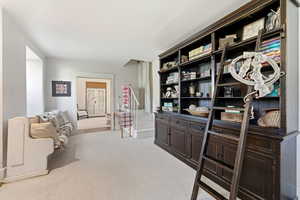 Sitting room with light carpet