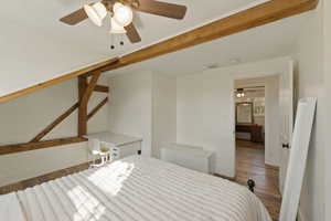 Bedroom with wood finished floors and ceiling fan