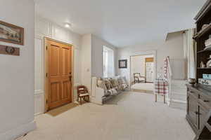 Sitting room with light colored carpet