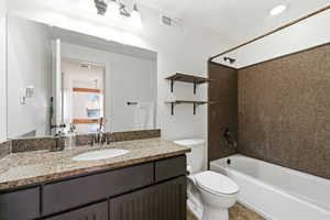 Full bathroom with vanity and tub / shower combination