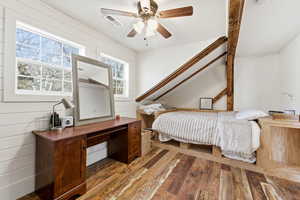 Bedroom featuring hardwood / wood-style floors and a ceiling fan