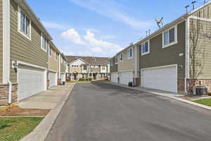 View of asphalt road featuring a residential view