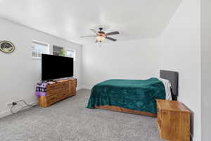 Bedroom featuring carpet and a ceiling fan