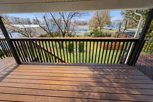 Deck featuring a yard