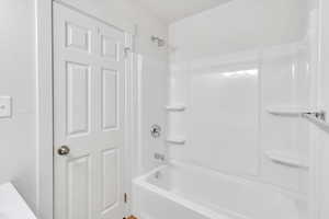 Full bathroom with shower / bath combination