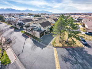 Aerial perspective of suburban area featuring a mountain backdrop