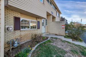 Entrance to property with brick siding