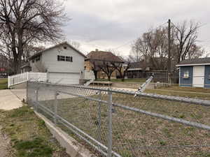 View of front of home with an attached garage and concrete driveway