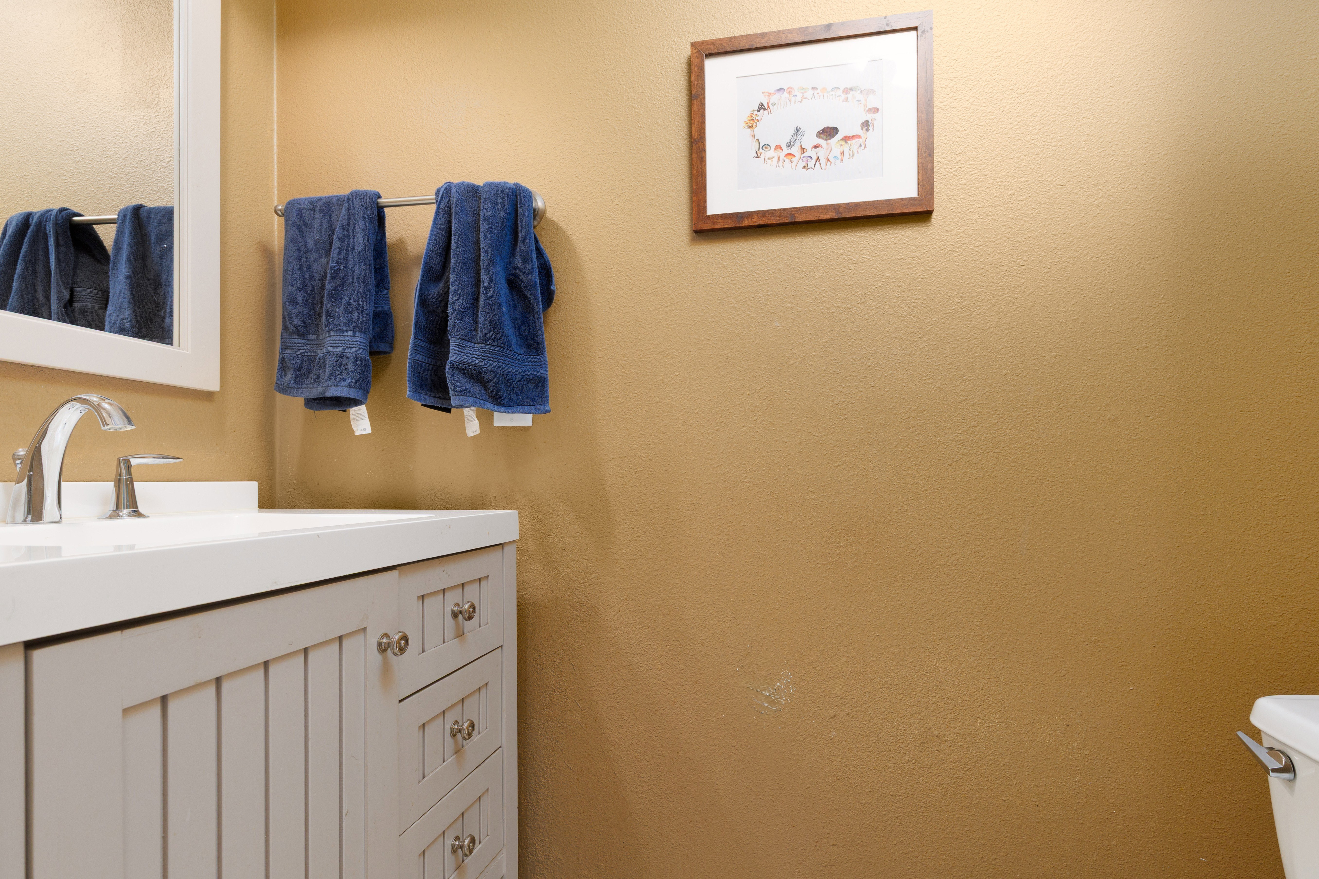 Half bath featuring vanity and toilet