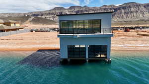 View of outdoor structure featuring a water and mountain view