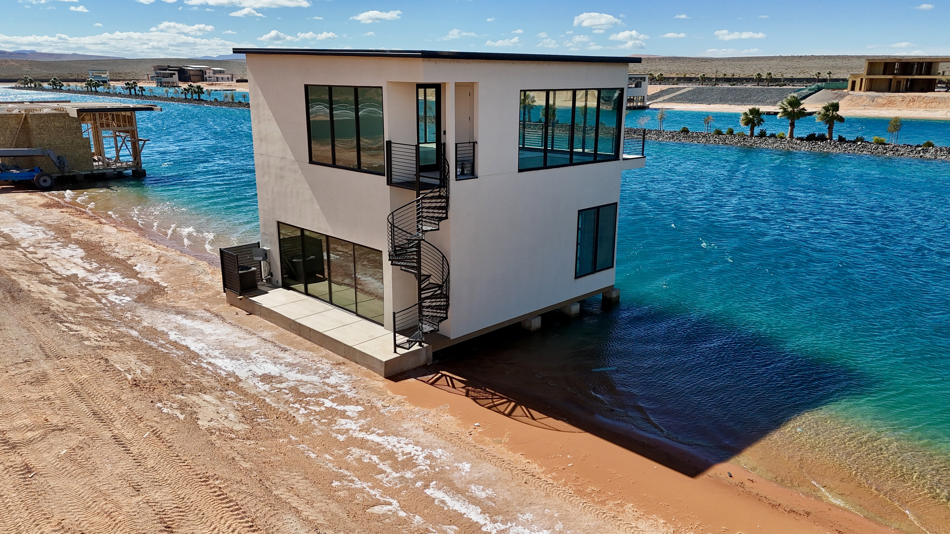 Dock area with view of water and beach