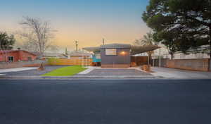 Manufactured / mobile home featuring a carport and concrete driveway