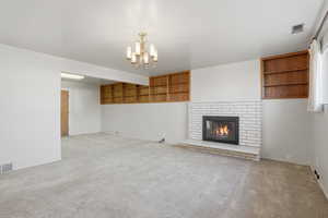 Family room with a fireplace and carpet floors