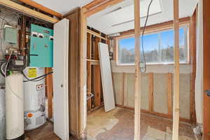Utility room featuring gas water heater