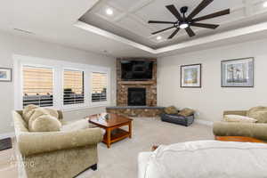 Living area featuring a fireplace, recessed lighting, ceiling fan, and light colored carpet
