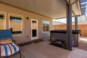 View of patio / terrace with a hot tub