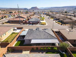 Aerial perspective of suburban area with a mountainous background