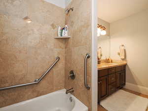 Full bathroom featuring vanity and shower / bath combination