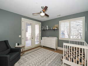 Bedroom with access to outside, ceiling fan, light colored carpet, and french doors