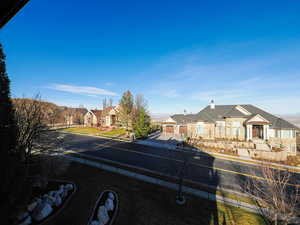 View of front of house featuring a chimney and a residential view