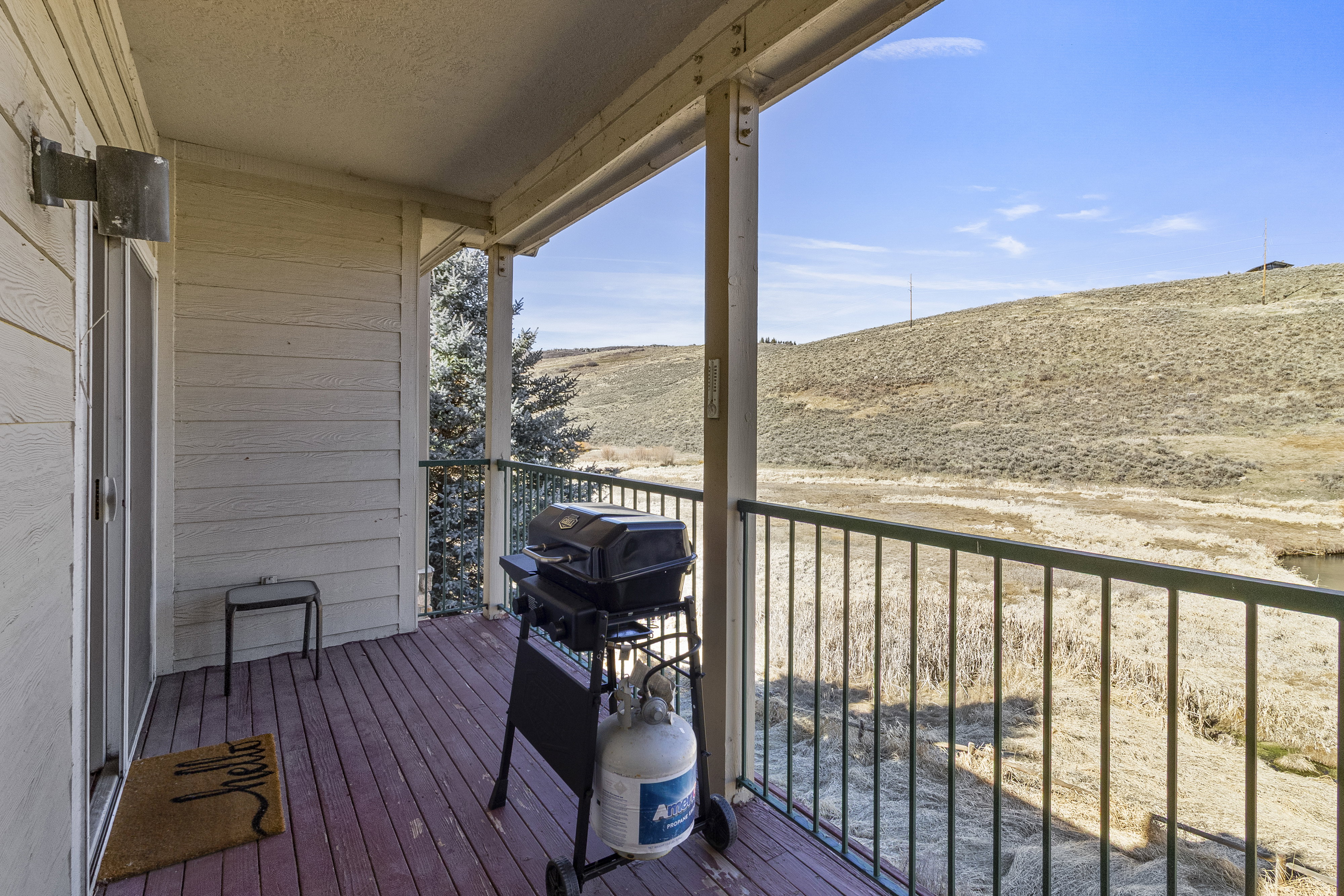 Balcony featuring area for grilling