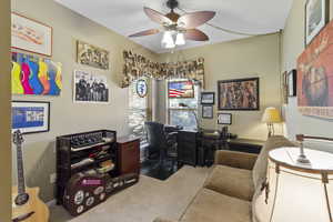 Office area featuring carpet flooring and a ceiling fan
