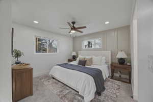 Bedroom with light carpet, a ceiling fan, and recessed lighting