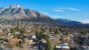 View of mountain background featuring nearby suburban area