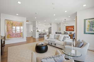 Living room featuring light wood finished floors and recessed lighting