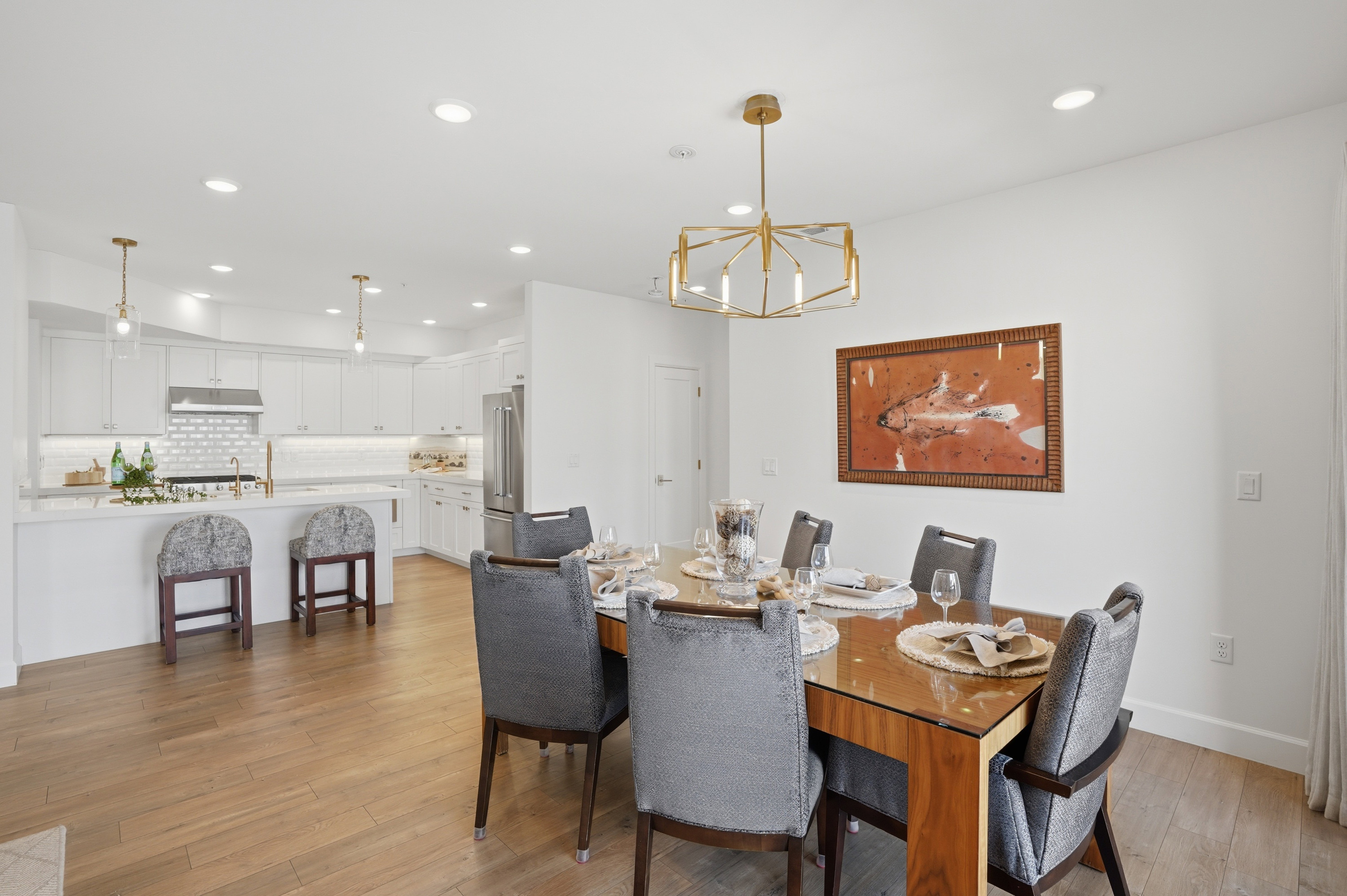 Dining room featuring suspended lighting and light wood-style floors